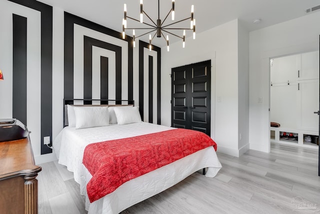 1132 N I St, Pensacola, FL 32501 - bedroom with a chandelier and light wood-type flooring