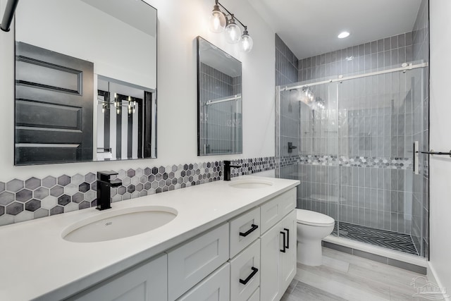 1132 N I St, Pensacola, FL 32501 - full bath featuring a shower stall, double vanity, recessed lighting, tile walls, and tasteful backsplash
