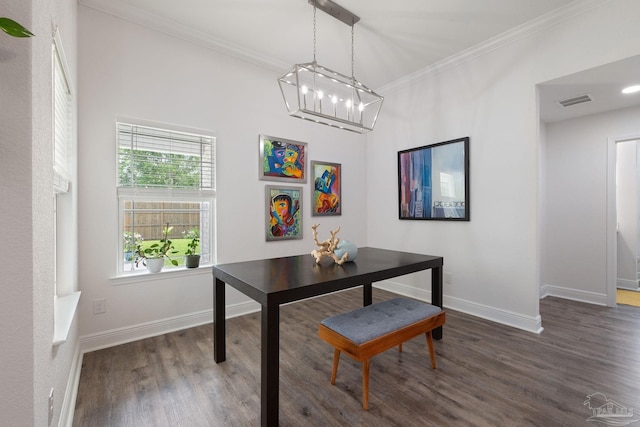 dining area with a notable chandelier, baseboards, wood finished floors, visible vents, and ornamental molding