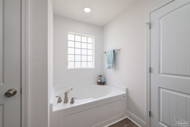 bathroom featuring a garden tub