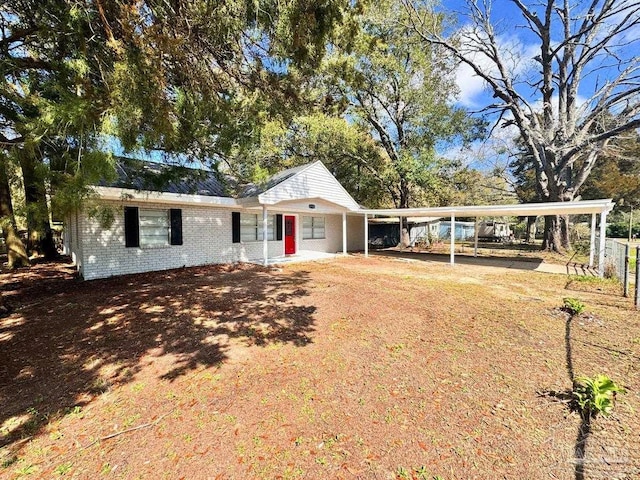 ranch-style home with brick siding and driveway