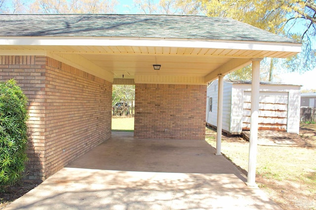 view of patio / terrace featuring an outdoor structure and an attached carport