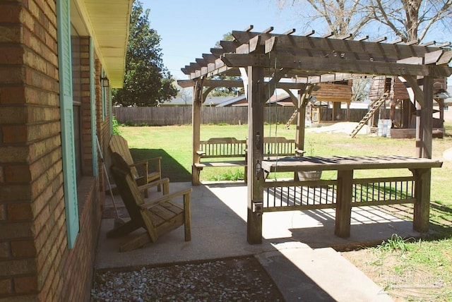 view of patio featuring a pergola and fence