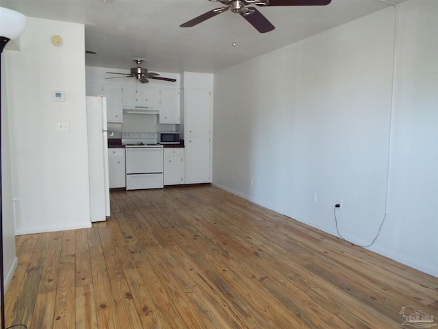 unfurnished living room featuring hardwood / wood-style flooring and ceiling fan