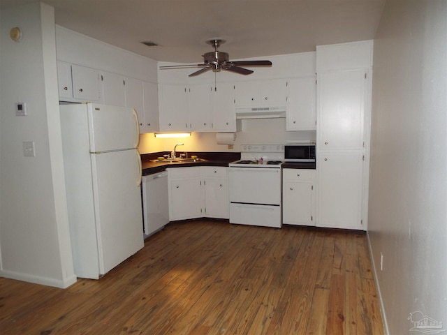 kitchen with dark hardwood / wood-style floors, white appliances, sink, and ceiling fan