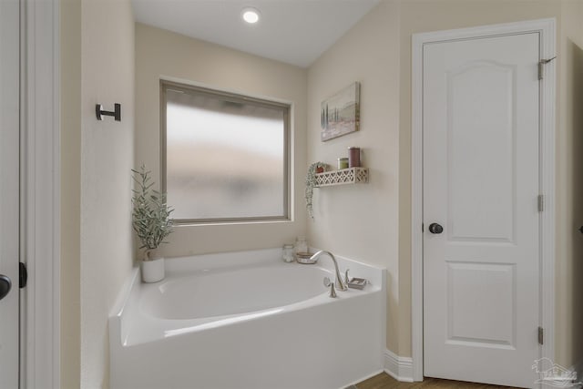 bathroom featuring a garden tub