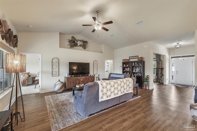 living room with dark wood-style flooring, visible vents, plenty of natural light, and ceiling fan