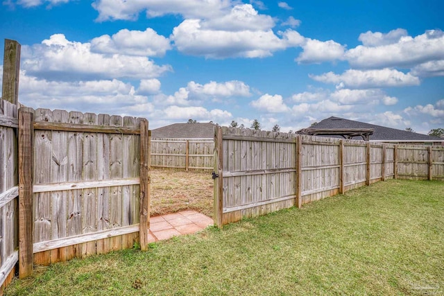 view of yard featuring a fenced backyard