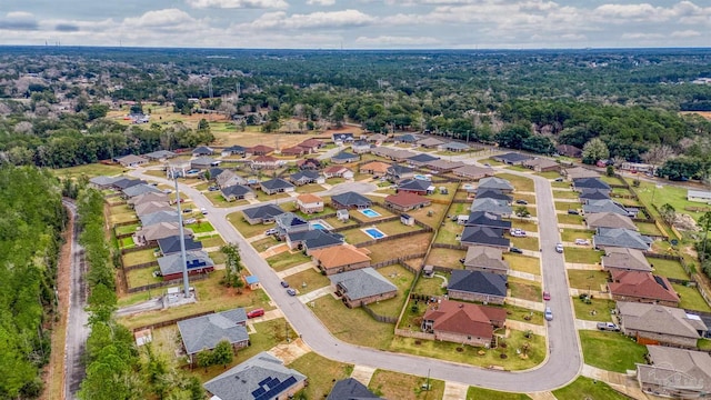 birds eye view of property with a residential view