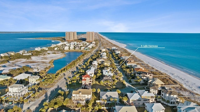 drone / aerial view with a water view and a view of the beach