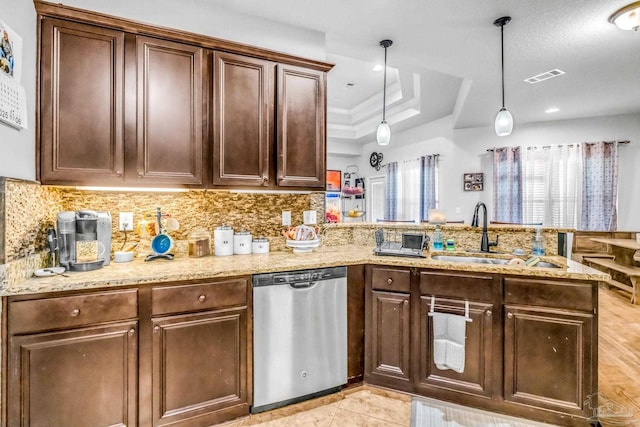2704 Wildhurst Trl, Pace, FL 32571 - kitchen with dishwasher, a peninsula, decorative backsplash, light stone countertops, and decorative light fixtures