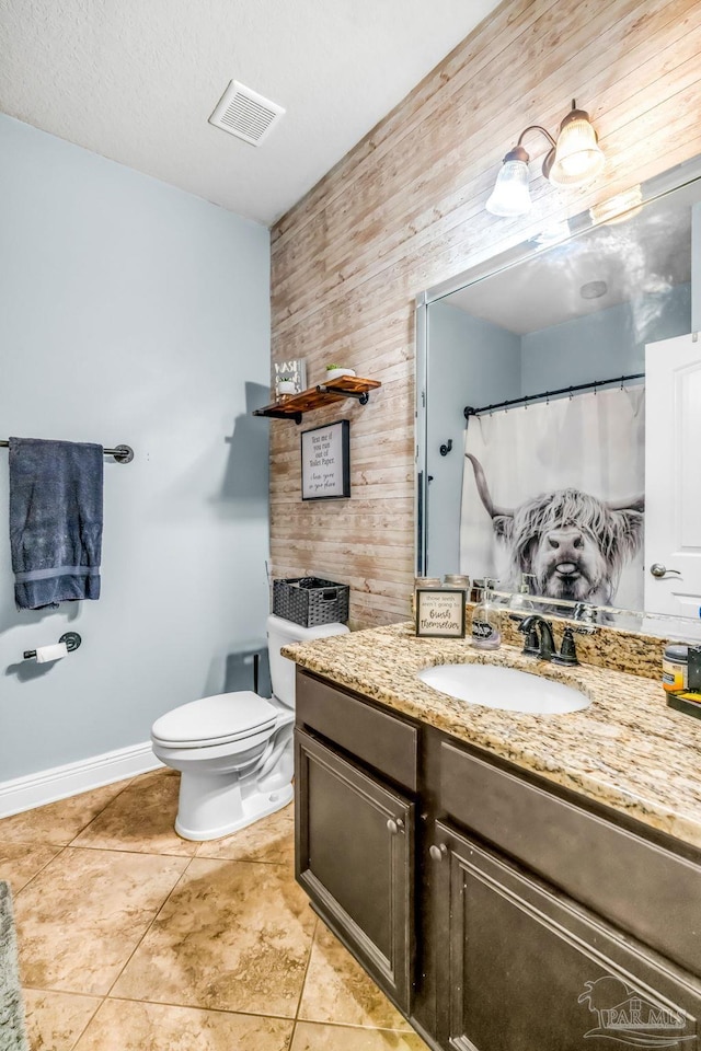 2704 Wildhurst Trl, Pace, FL 32571 - bathroom with wooden walls, vanity, and tile patterned floors