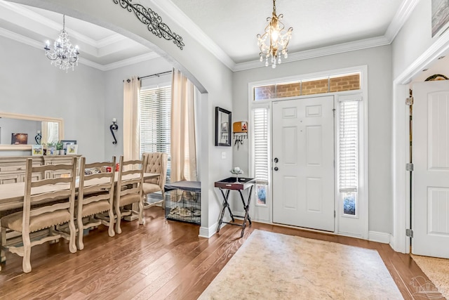 2704 Wildhurst Trl, Pace, FL 32571 - entrance foyer with a chandelier, arched walkways, hardwood / wood-style floors, and ornamental molding