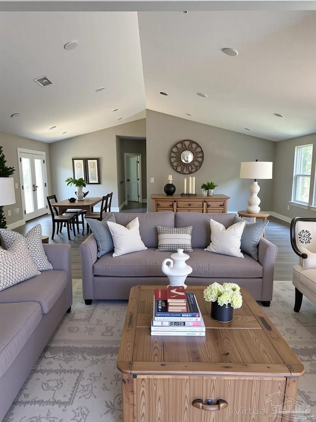 5661 Dupree Rd, Milton, FL 32570 - living area featuring vaulted ceiling and light wood-style flooring