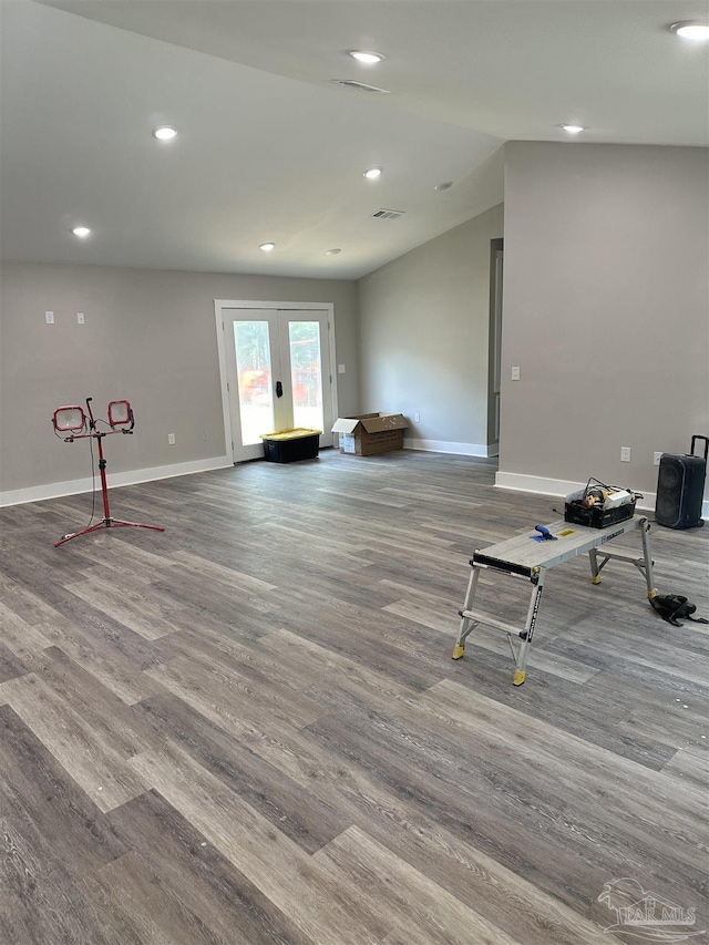 5661 Dupree Rd, Milton, FL 32570 - unfurnished living room featuring wood finished floors, recessed lighting, lofted ceiling, and french doors
