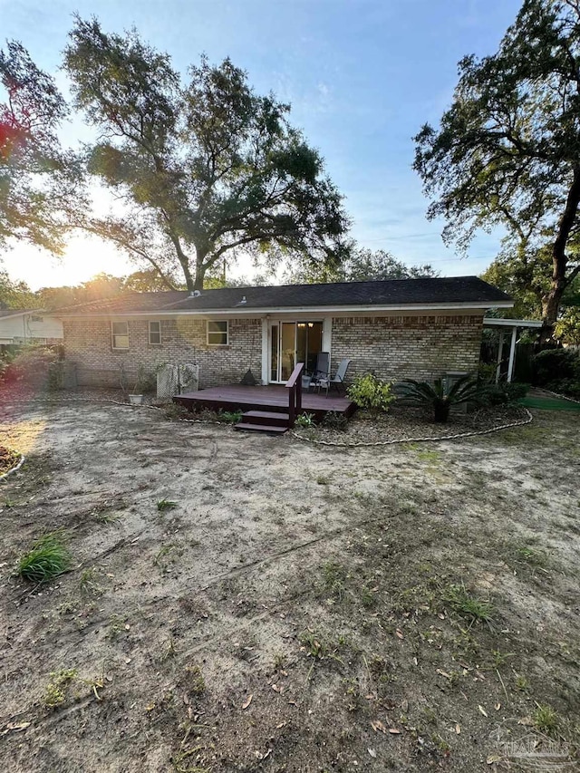 back of property featuring a deck