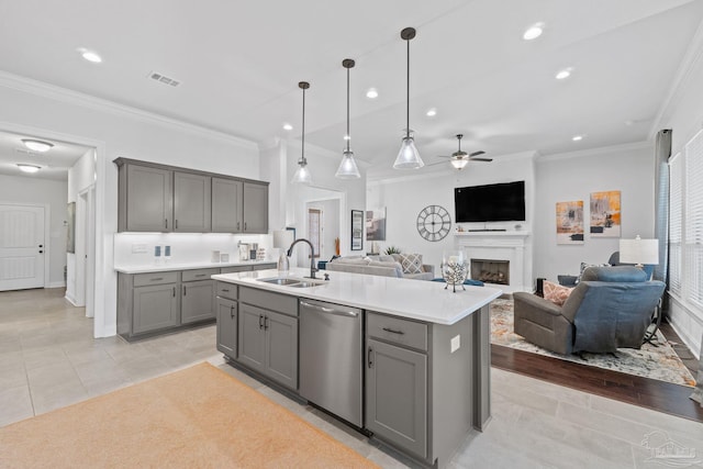 kitchen featuring light countertops, gray cabinetry, dishwasher, and a sink