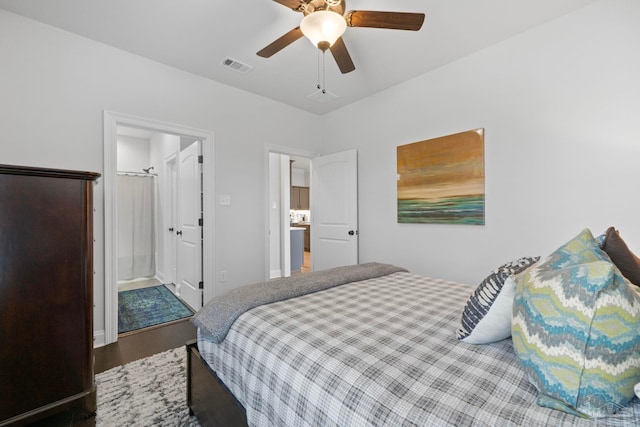 bedroom featuring a ceiling fan, visible vents, wood finished floors, and baseboards