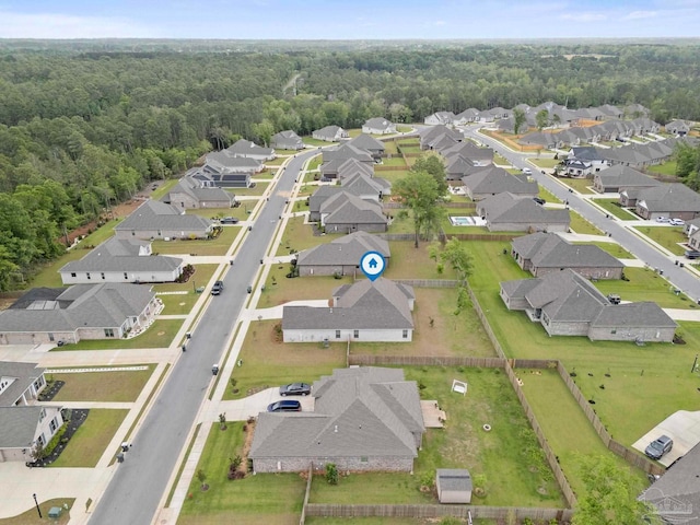 aerial view featuring a residential view and a forest view