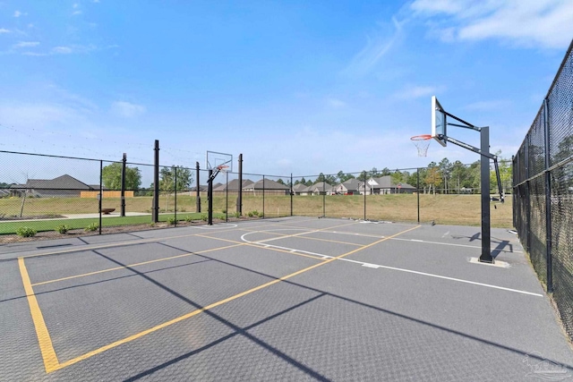 view of sport court featuring fence and community basketball court