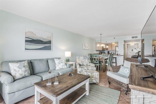 14623 Perdido Key Dr Unit W502, Pensacola, FL 32507 - living area with light tile patterned floors, a notable chandelier, and visible vents