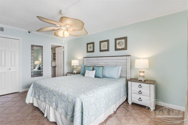 14623 Perdido Key Dr Unit W502, Pensacola, FL 32507 - bedroom with a closet, visible vents, ceiling fan, crown molding, and tile patterned flooring