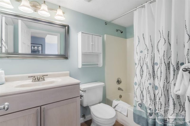 full bathroom featuring shower / tub combo, vanity, and toilet