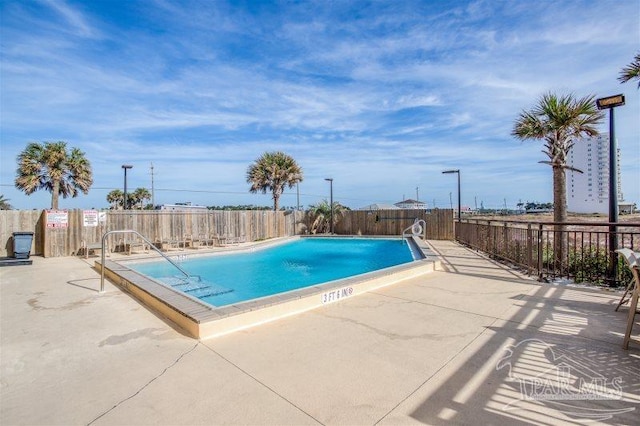 14623 Perdido Key Dr Unit W502, Pensacola, FL 32507 - community pool featuring a patio and a fenced backyard