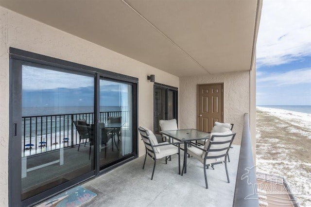 14623 Perdido Key Dr Unit W502, Pensacola, FL 32507 - balcony featuring a water view, a view of the beach, and outdoor dining space