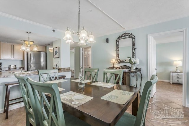 14623 Perdido Key Dr Unit W502, Pensacola, FL 32507 - dining area with crown molding, light tile patterned flooring, a notable chandelier, and baseboards