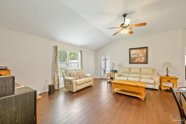 living room with ceiling fan, vaulted ceiling, and dark hardwood / wood-style flooring