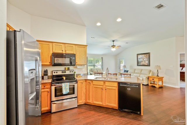 kitchen featuring lofted ceiling, dark wood-type flooring, ceiling fan, sink, and black appliances