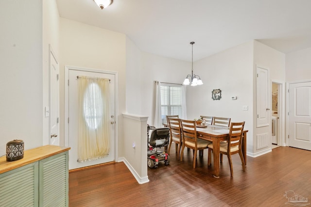 dining room with a notable chandelier and hardwood / wood-style flooring