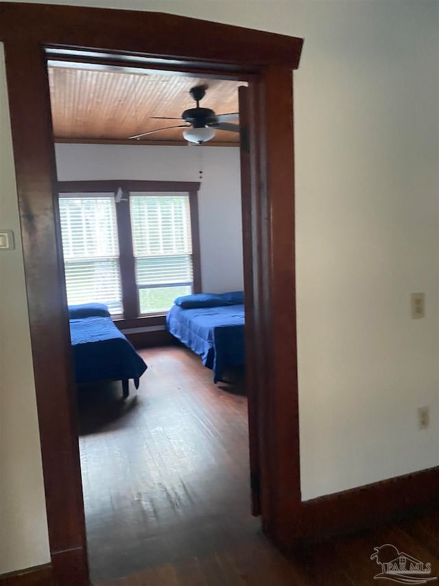 bedroom featuring ceiling fan, hardwood / wood-style flooring, and wood ceiling