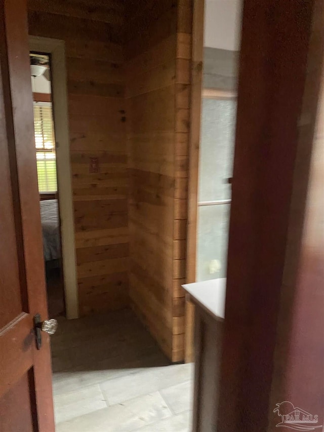 bathroom with wooden walls