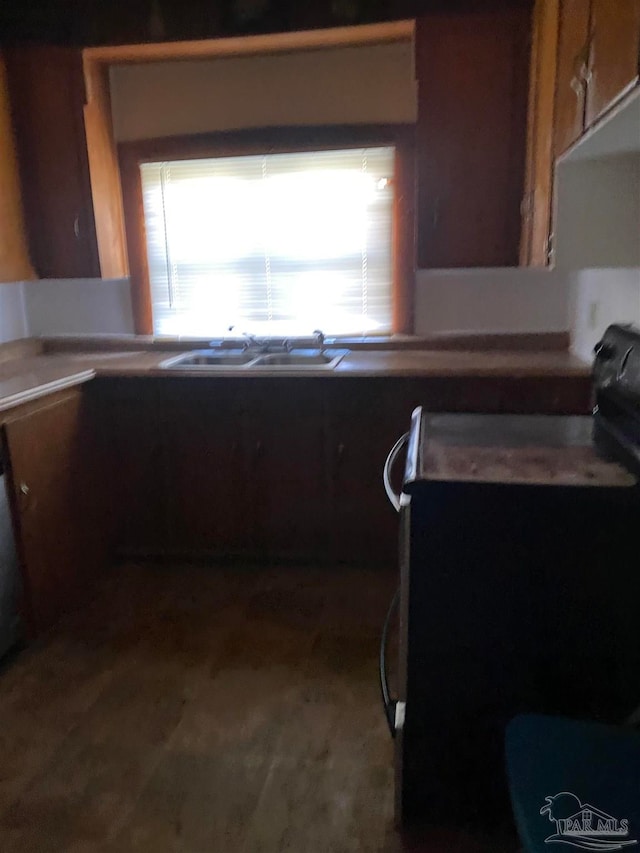 kitchen with black range oven and sink