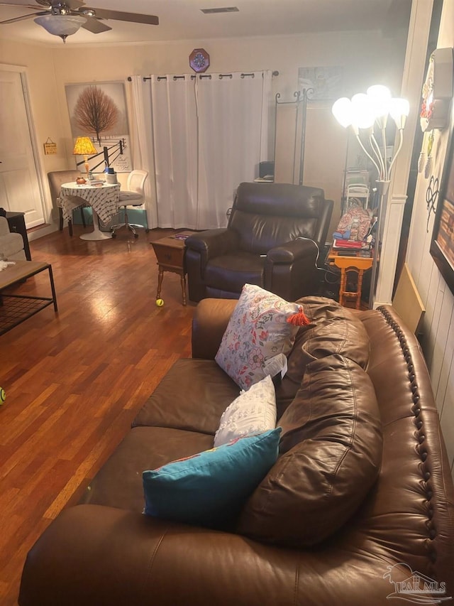 living room featuring ceiling fan and wood-type flooring