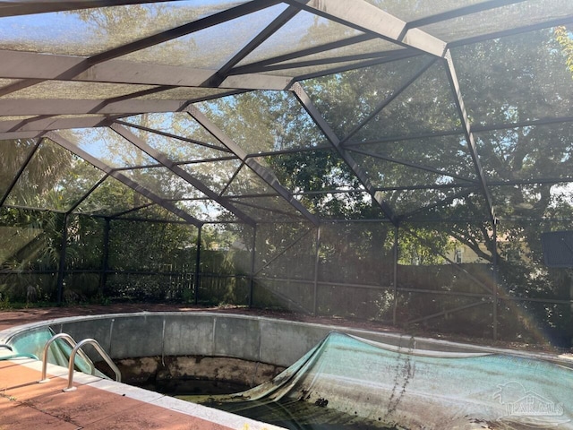 view of pool featuring a lanai