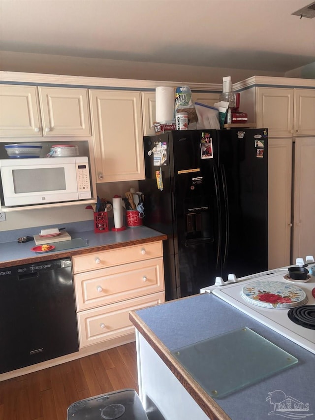 kitchen with wood-type flooring and black appliances