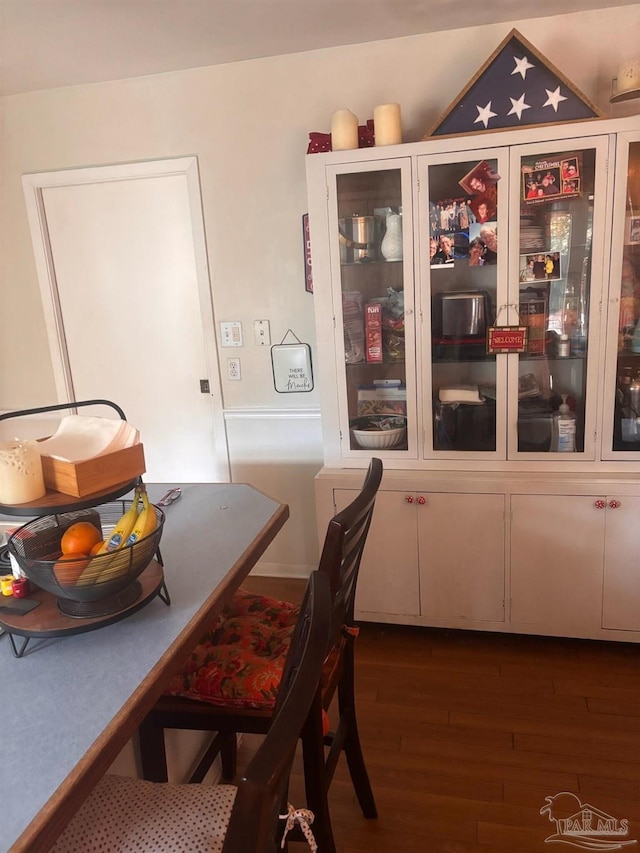 dining area with dark hardwood / wood-style floors