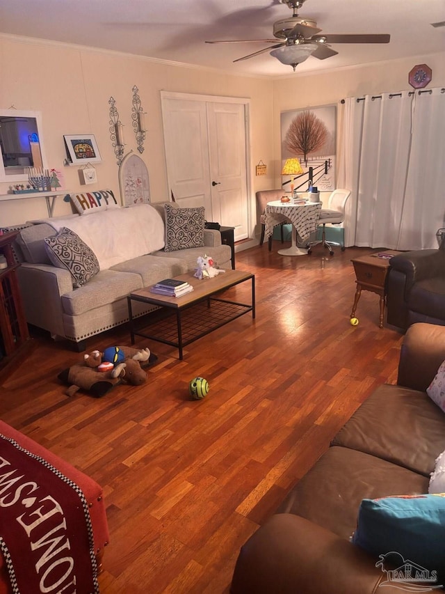 living room with wood-type flooring and ceiling fan