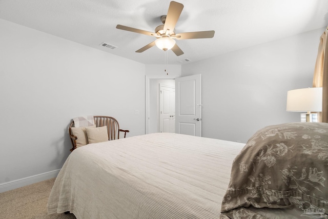 bedroom with ceiling fan and carpet flooring