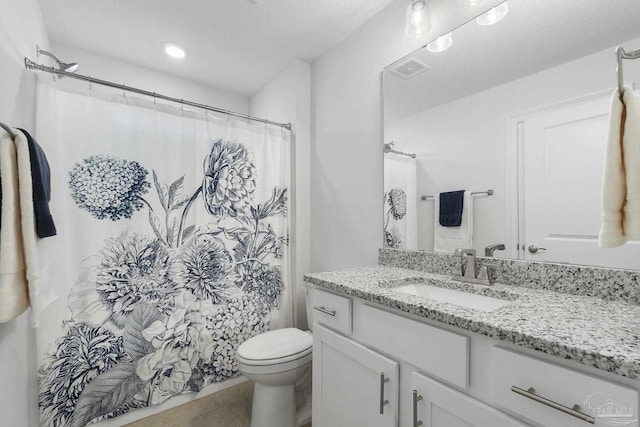 bathroom featuring toilet, tile patterned flooring, a shower with curtain, and vanity