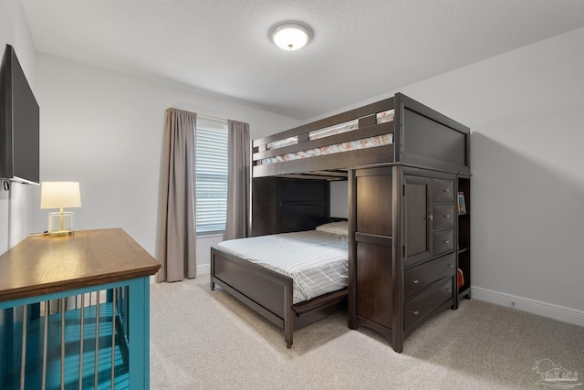 carpeted bedroom with a textured ceiling