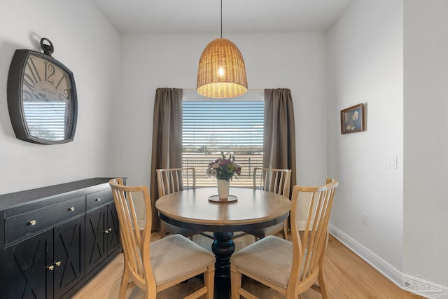 dining area with light wood-type flooring