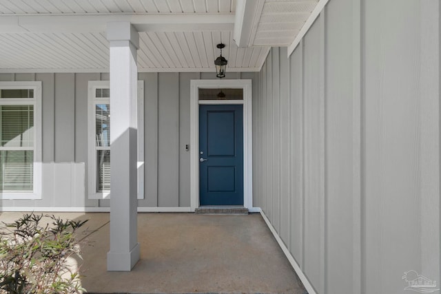 view of exterior entry featuring a porch