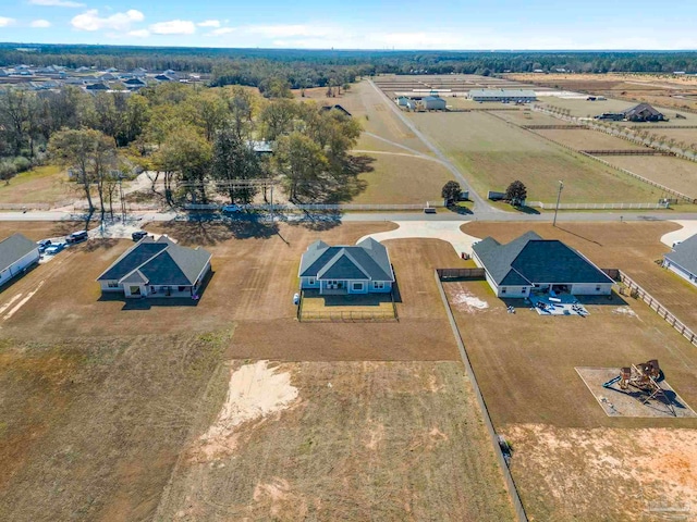 birds eye view of property with a rural view