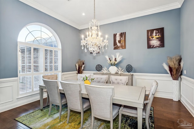 dining space with crown molding, dark hardwood / wood-style flooring, and a notable chandelier