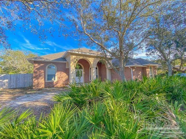 1358 Windsor Park Rd, Gulf Breeze, FL 32563 - mediterranean / spanish home featuring brick siding