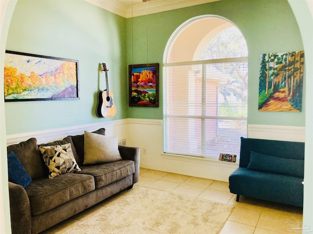 1358 Windsor Park Rd, Gulf Breeze, FL 32563 - living area with tile patterned floors, wainscoting, and ornamental molding
